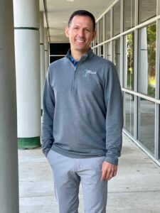 Friendly chiropractor outside Shaw Chiropractic Jacksonville, offering quality spinal and back pain relief services.