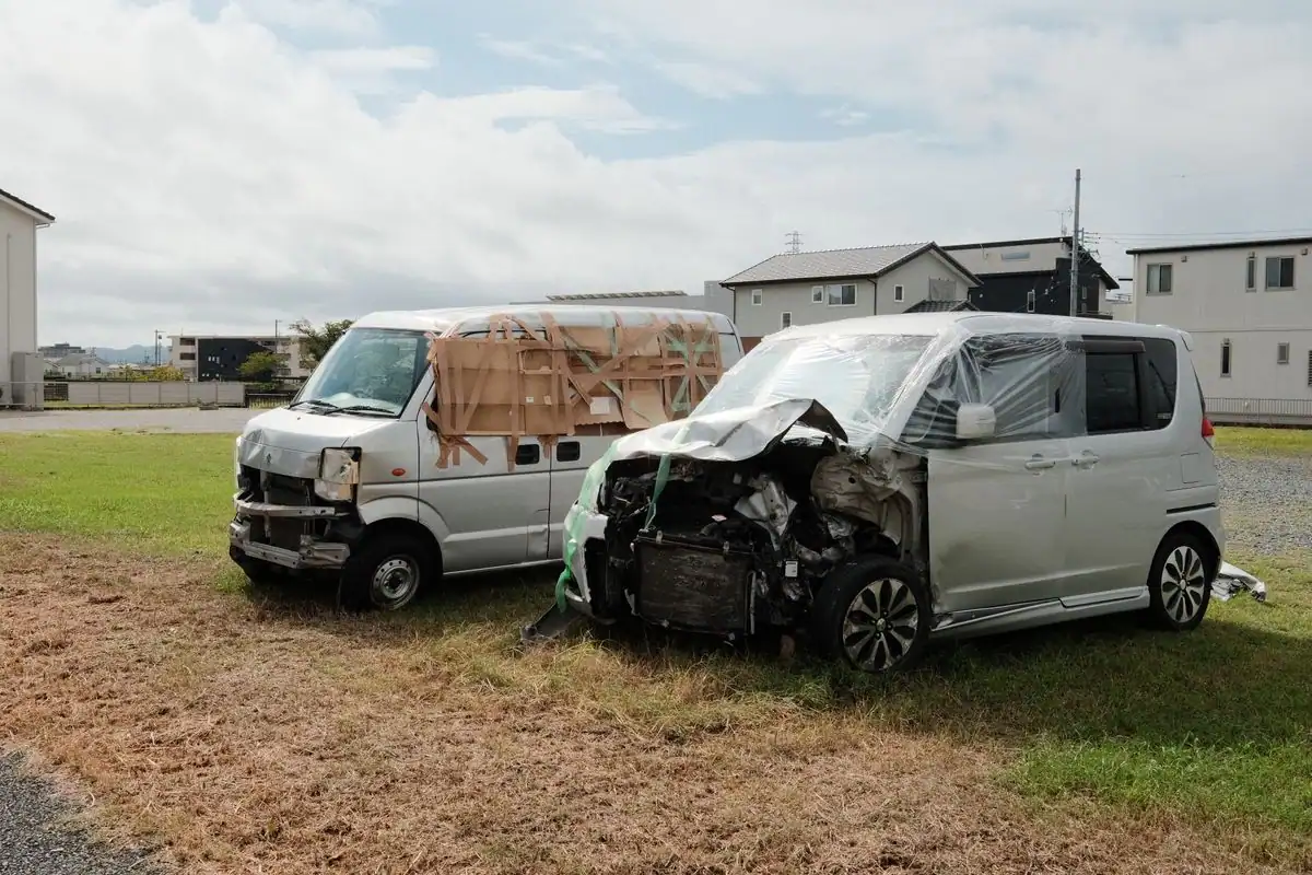 Two damaged vehicles after a minor car accident in a residential area