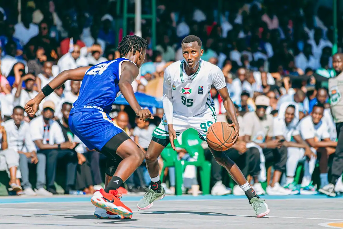 Two players competing hard in an outdoor street basketball game