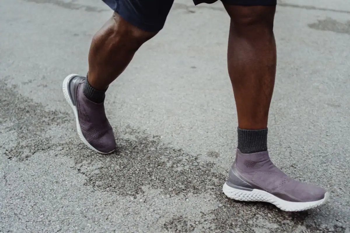 A person in athletic shoes out for a walk